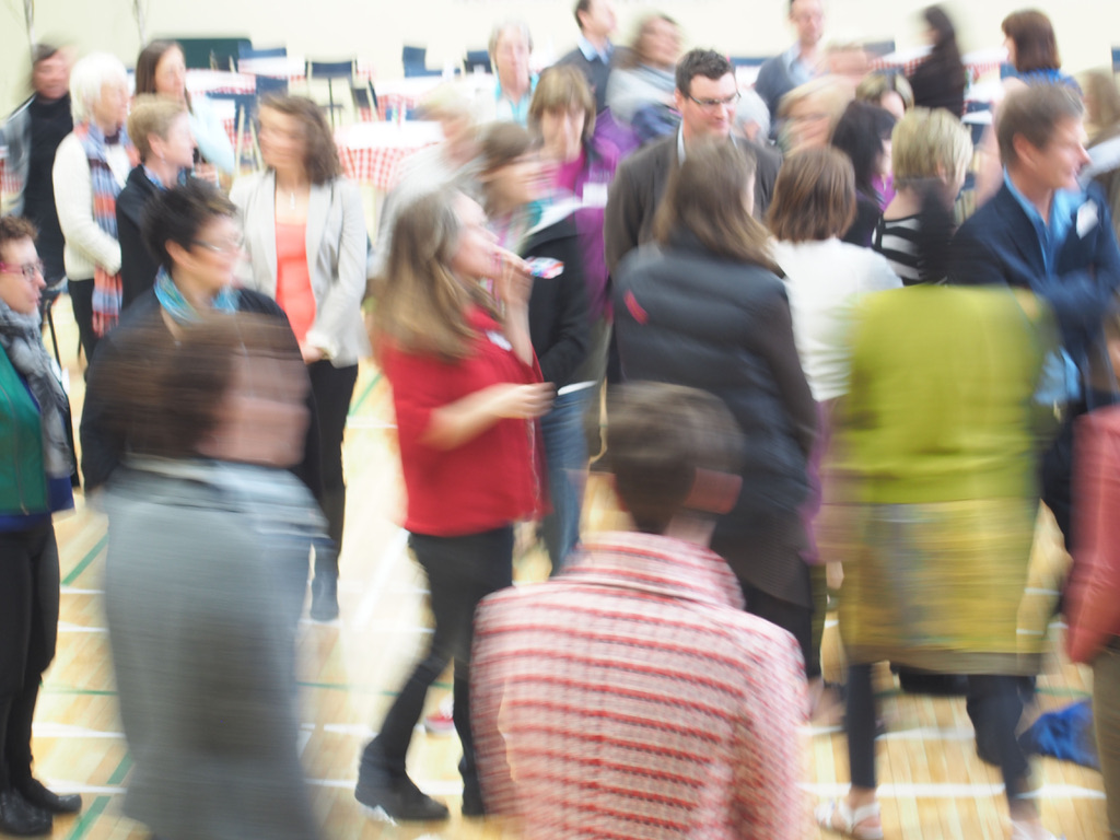 A crowd of people moving